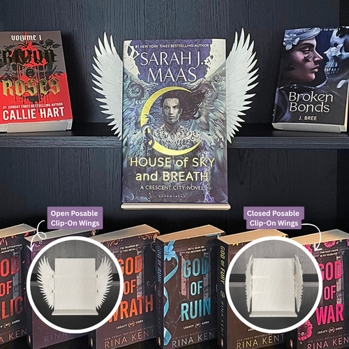 Curio Clip-On Angel Wings attached to the Curio Candy Floating Book Display Hanger, fitting snugly on a bookshelf behind Sarah J. Maas's House of Sky and Breath cover—perfect for dark romance and spicy paranormal book displays, with open and closed posable wing options.