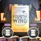 Curio Clip-On Posable Gothic Dragon Bat Wings attached to a Curio Candy Floating Book Display Hanger, showing open and closed posable positions with Rebecca Yarros's Fourth Wing on a fantasy book bookshelf.