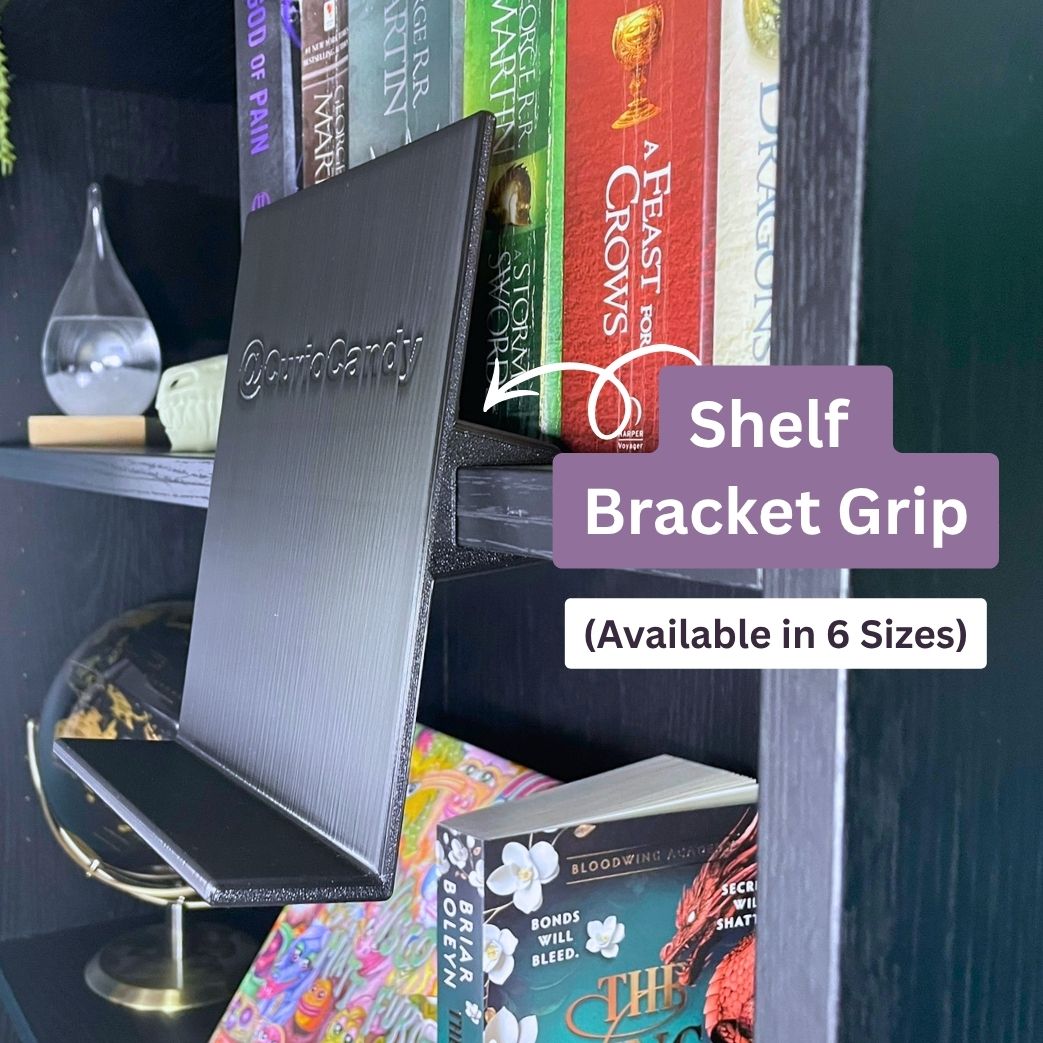 Curio Candy Original black floating book display hanger with shelf bracket grip on black IKEA Billy bookshelf, 3D printed holder in 6 sizes.