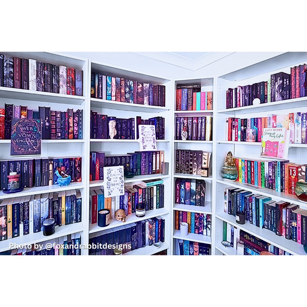 Curio Candy floating book display hangers showcasing special edition fantasy novels on white home library bookshelf wall decor.