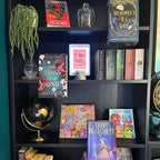 Curio Candy floating book display hangers presenting fantasy special edition novels on black IKEA Billy bookshelf decor display.