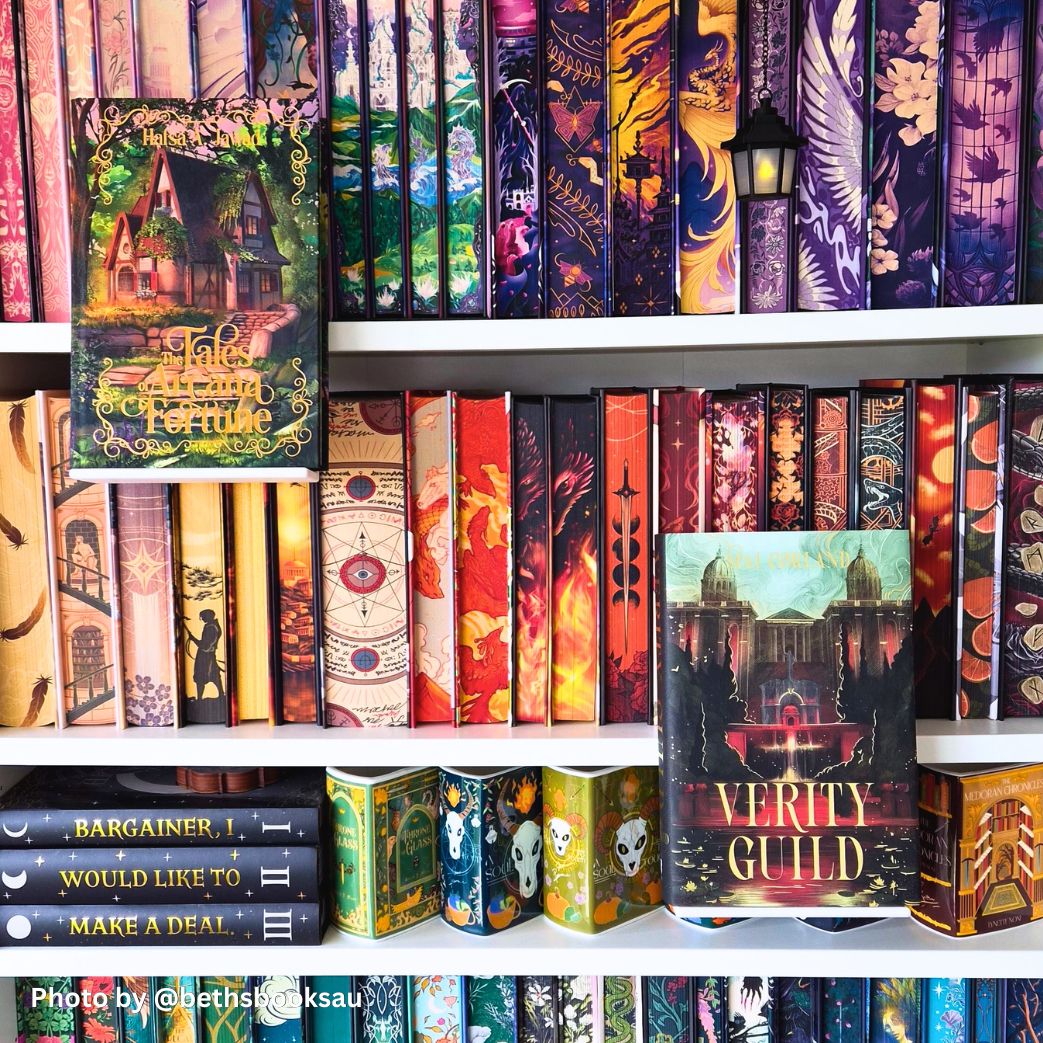Fantasy special edition hardcovers on white bookshelf with custom painted edges and 3D printed floating book display ledge holding Tales of Arcana and Fortune.